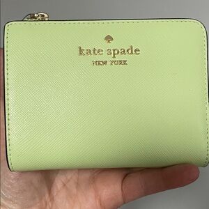 kate spade mint green zip-around wallet with gold logo
